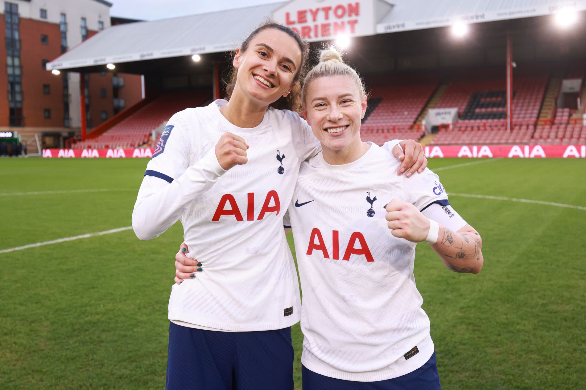 Rosella Ayane and Beth England hug and hold up a fist each to celebrate the victory.