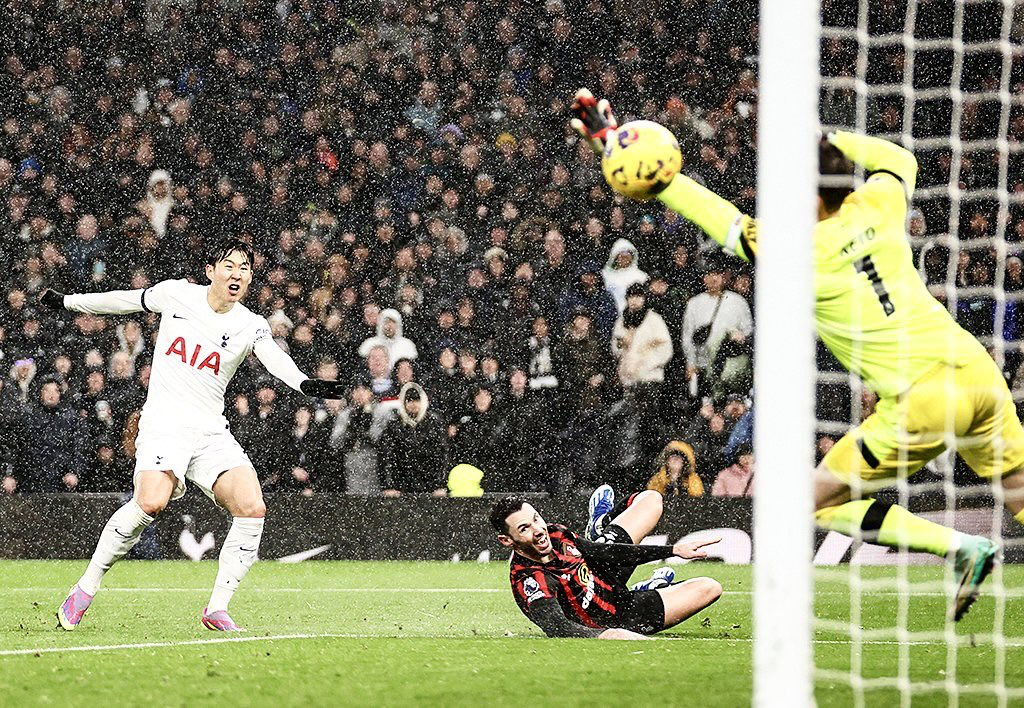 Son Heung-min shoots past Neto.