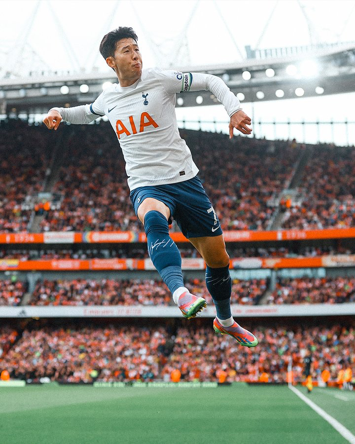 Son Heung-min leaps up to celebrate a goal against Arsenal.