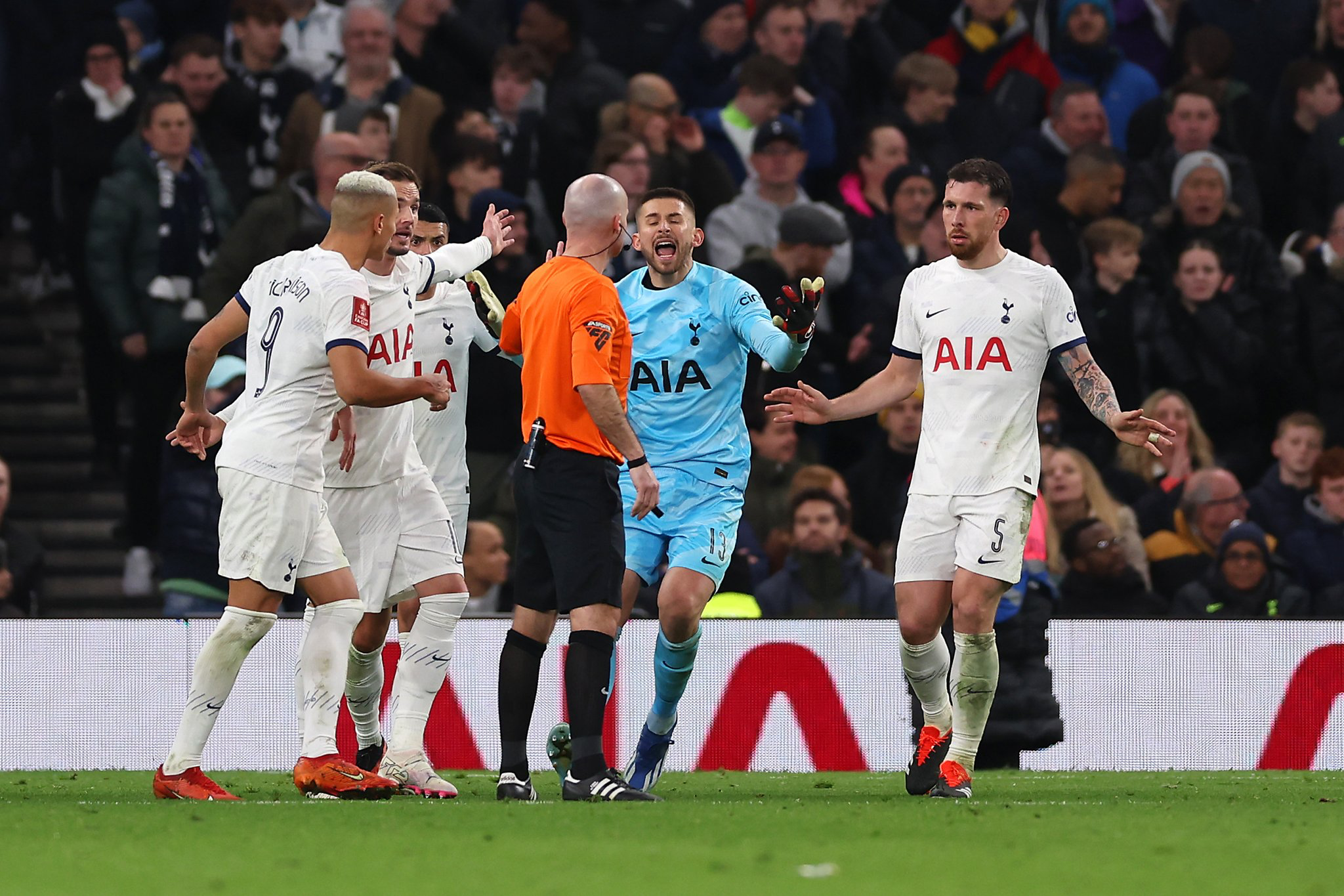 Several Spurs player protest to head official Paul Tierney.