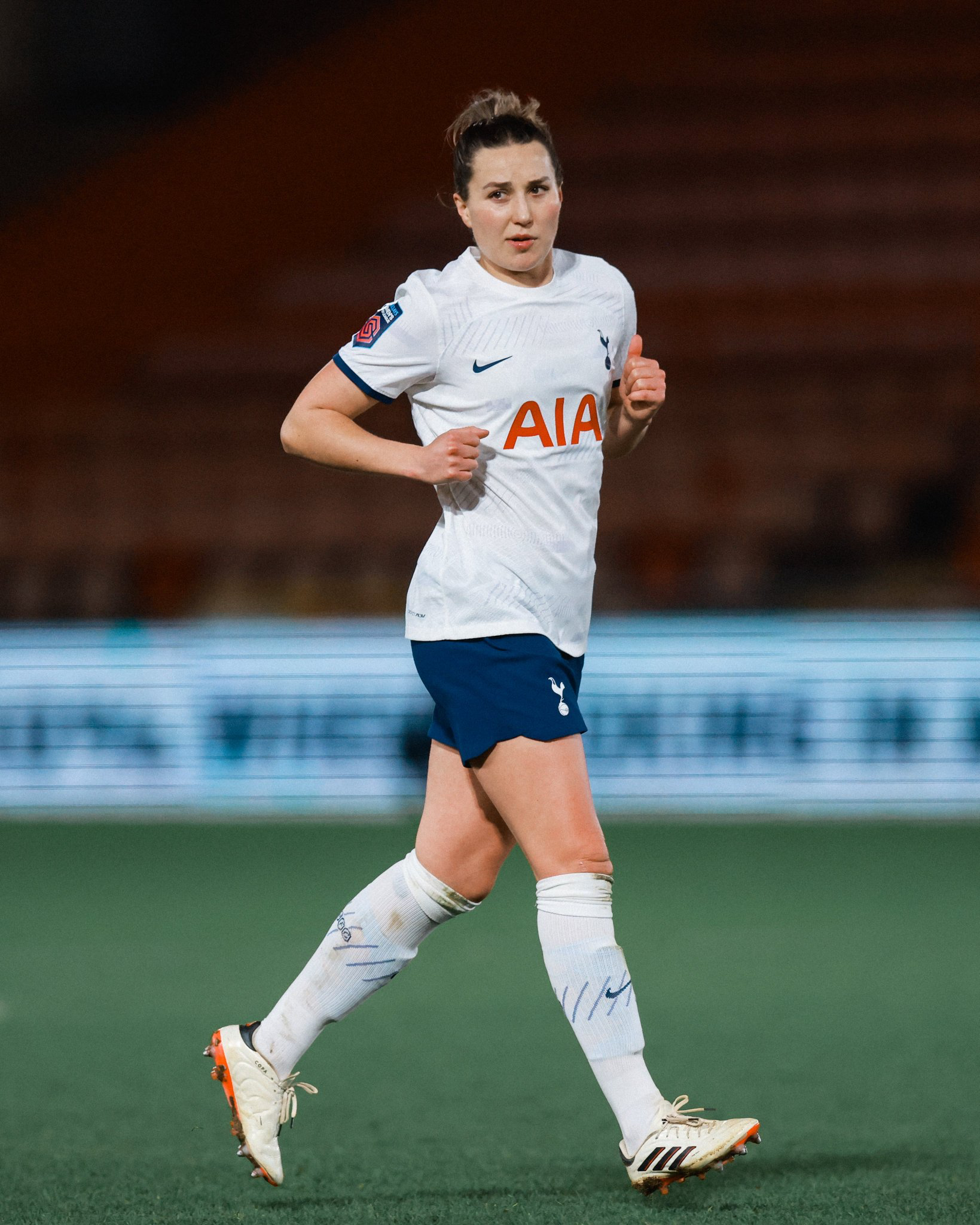 Amy Turner jogs on the pitch.