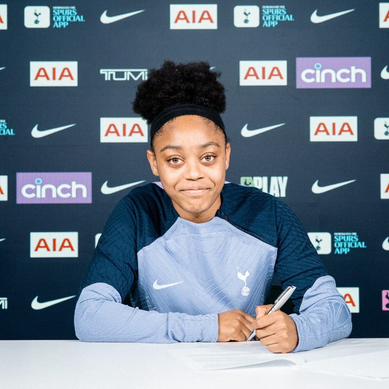 Araya Dennis signs her first professional contract.