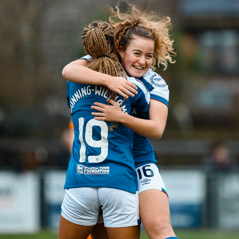 Elkie Bowyer hugs Lenna Gunning-Williams after scoring her first pro goal.