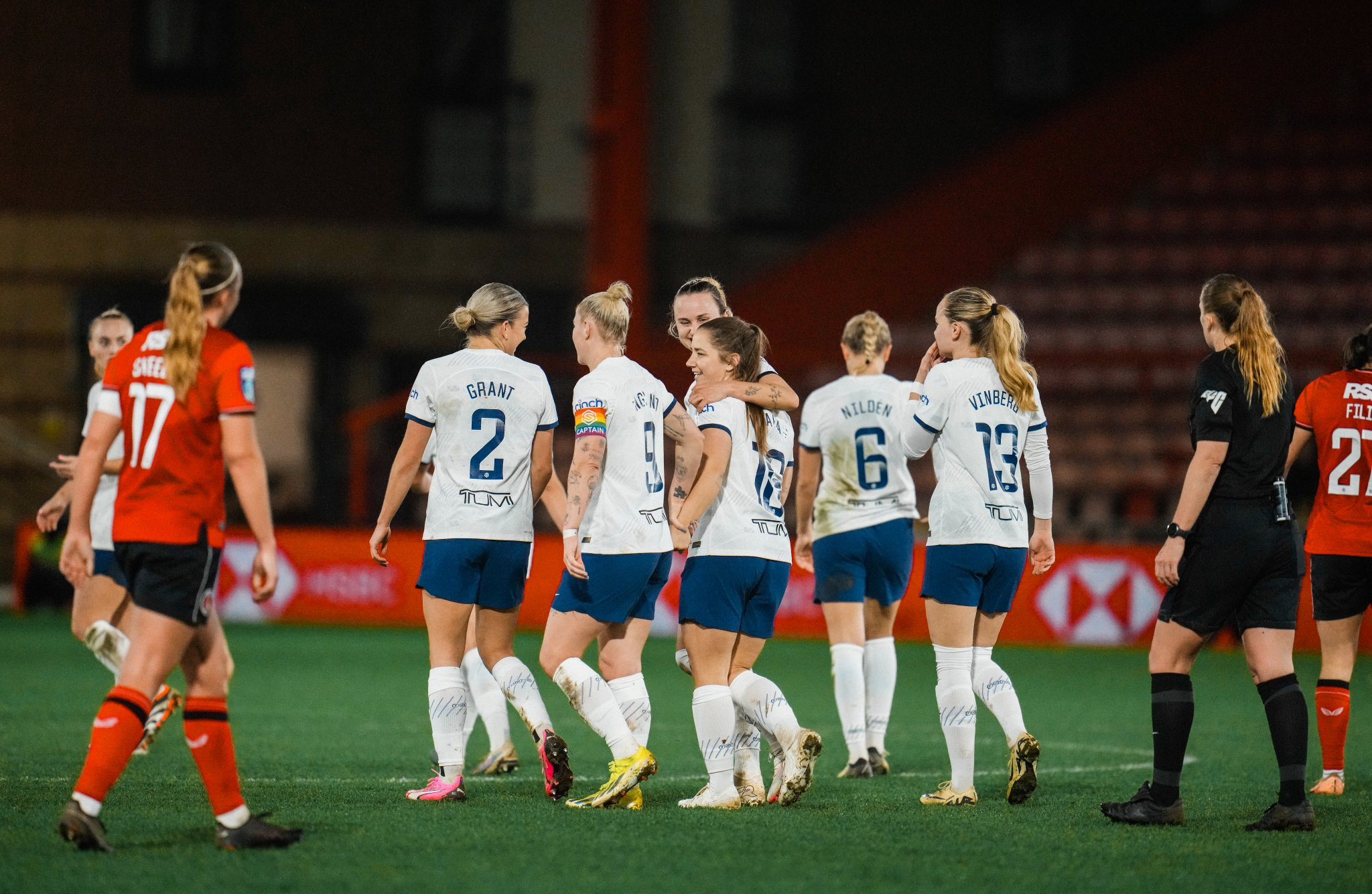 Martha Thomas puts her arm around Kit Graham to celebrate the midfielder's game-winning goal.