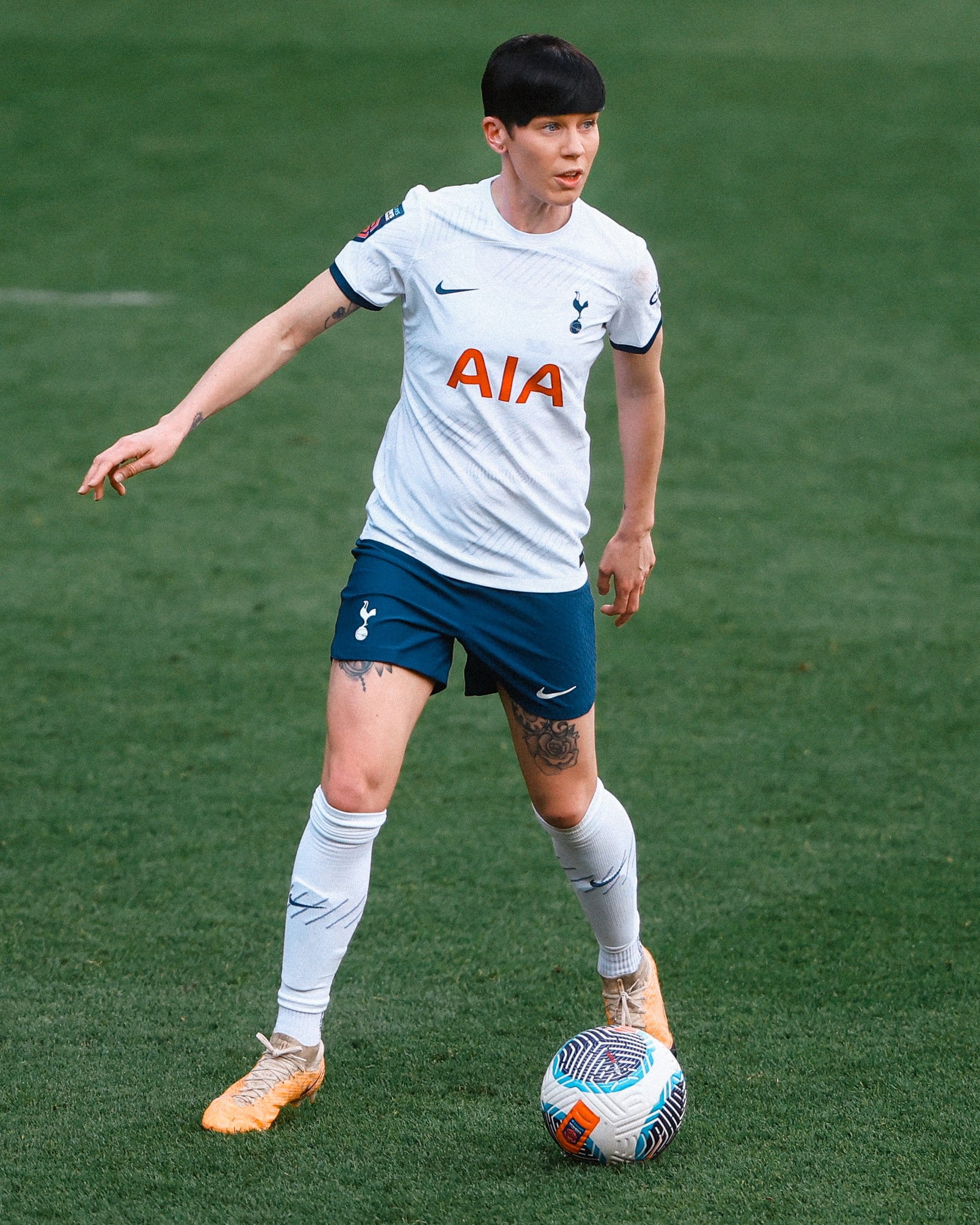 Ash Neville stands over the ball in her 150th appearance for Spurs.