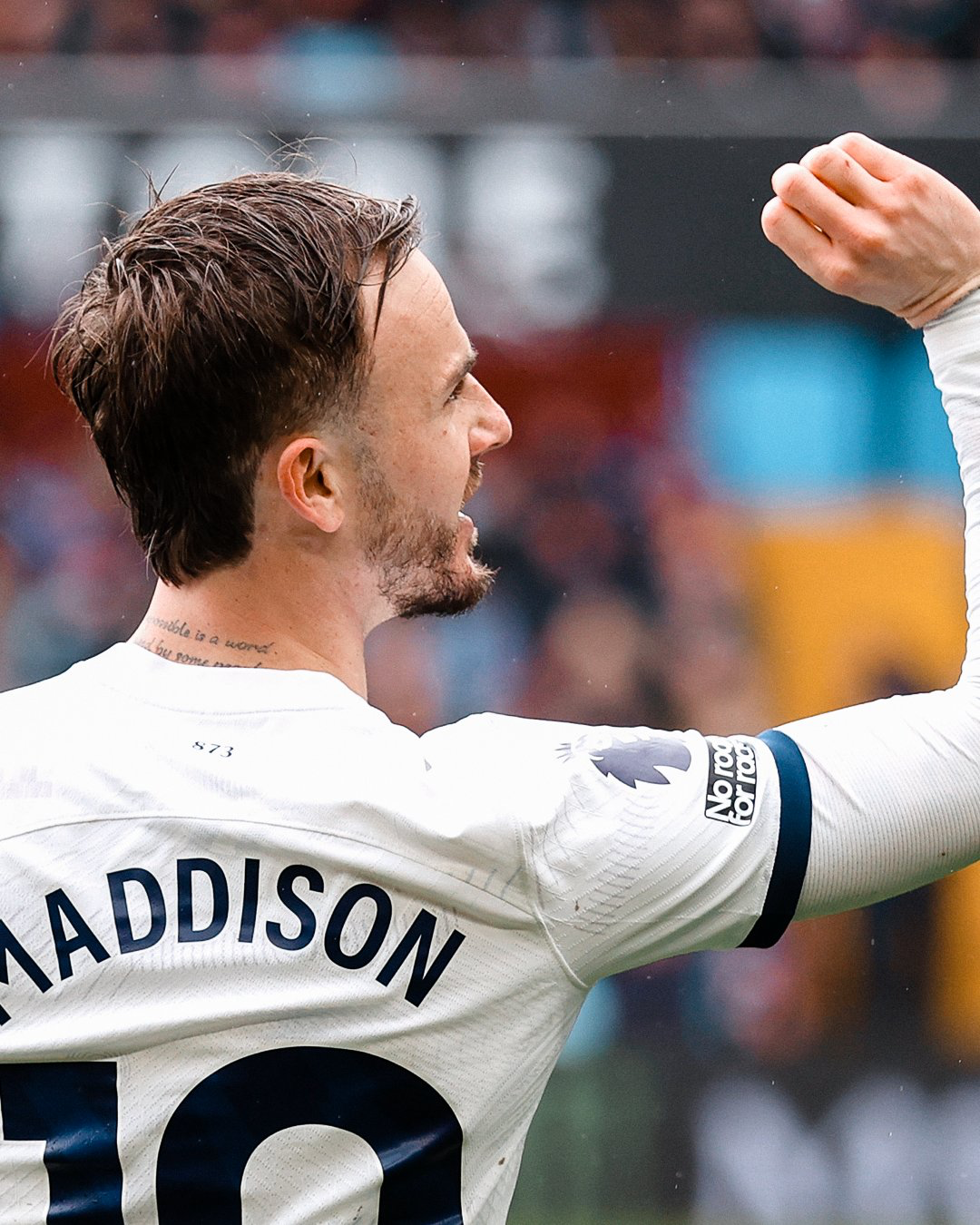 James Maddison pretends to throw a dart to celebrate his goal.