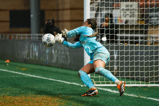 Becky Spencer makes a penalty save.