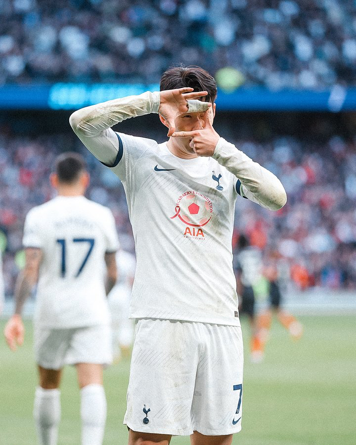 Son Heung-min does his signature camera goal celebration.