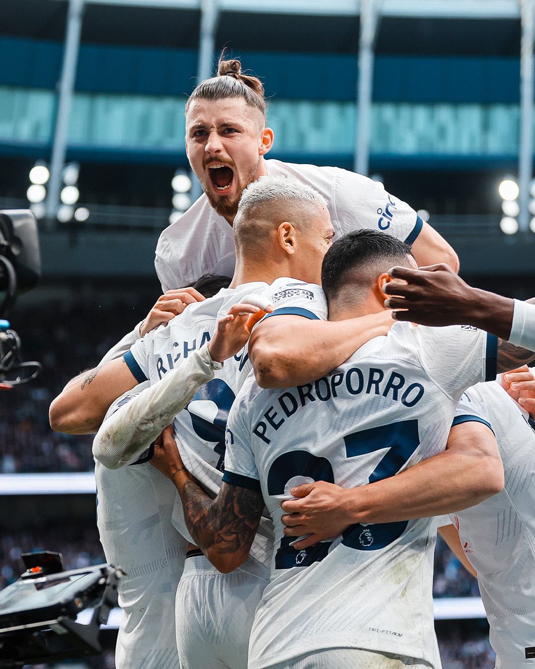 Radu Drâguşin jumps on his teammates during a goal celebration.