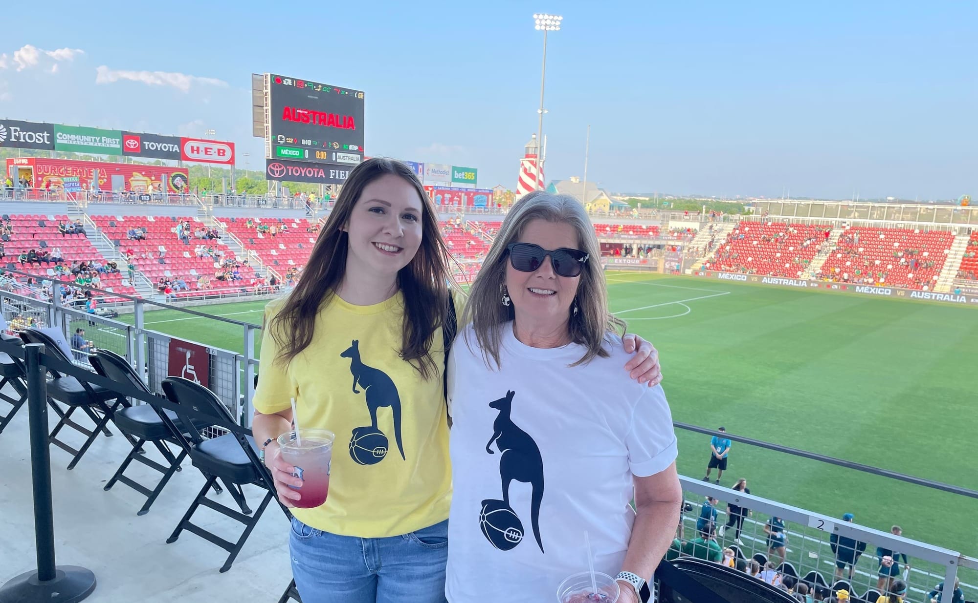 My mom and me posing above the pitch at Toyota Field in our "Spurstralia" shirts.
