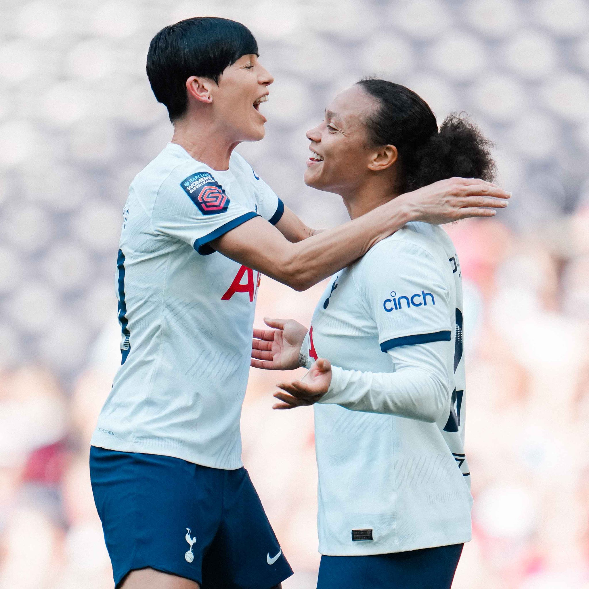 Drew Spence celebrates her goal with Ash Neville.