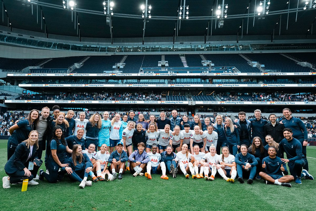 The full Spurs Women squad and staff pose in the stadium after the final game.