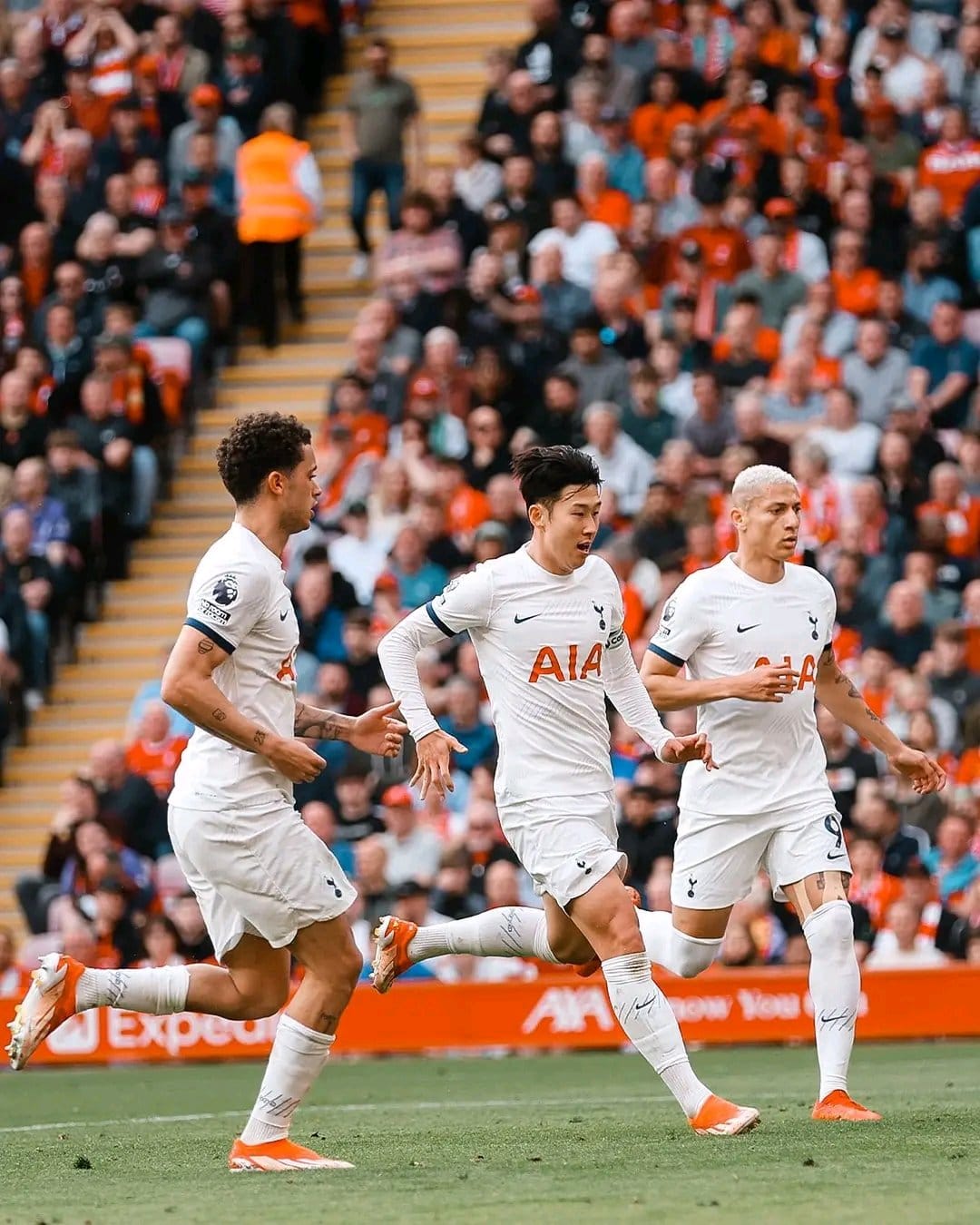 Brennan Johnson, Son Heung-min, and Richarlison run together.