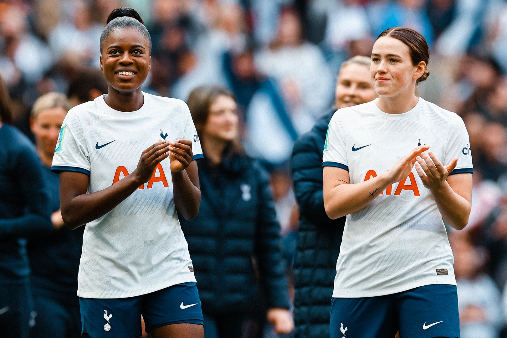 Jess Naz and Grace Clinton applaud the fans after a recent game.