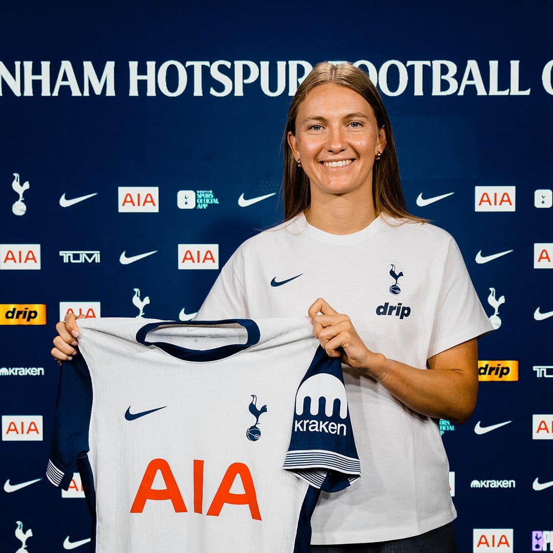 Clare Hunt holds up her new Spurs shirt.