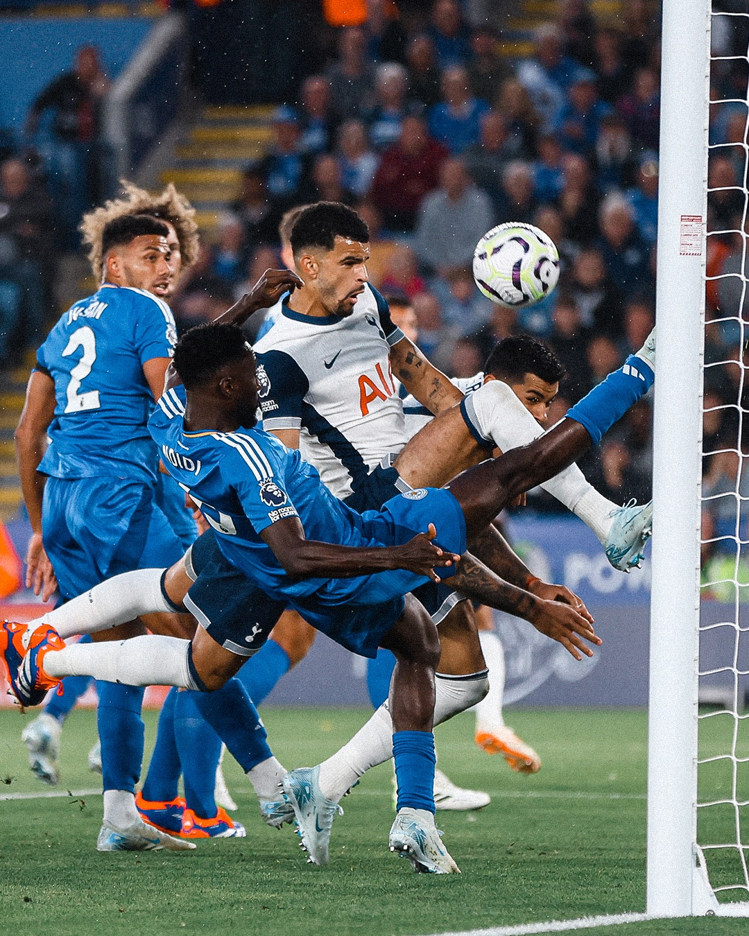 Dominic Solanke challenges for the ball in a crowded Leicester box.