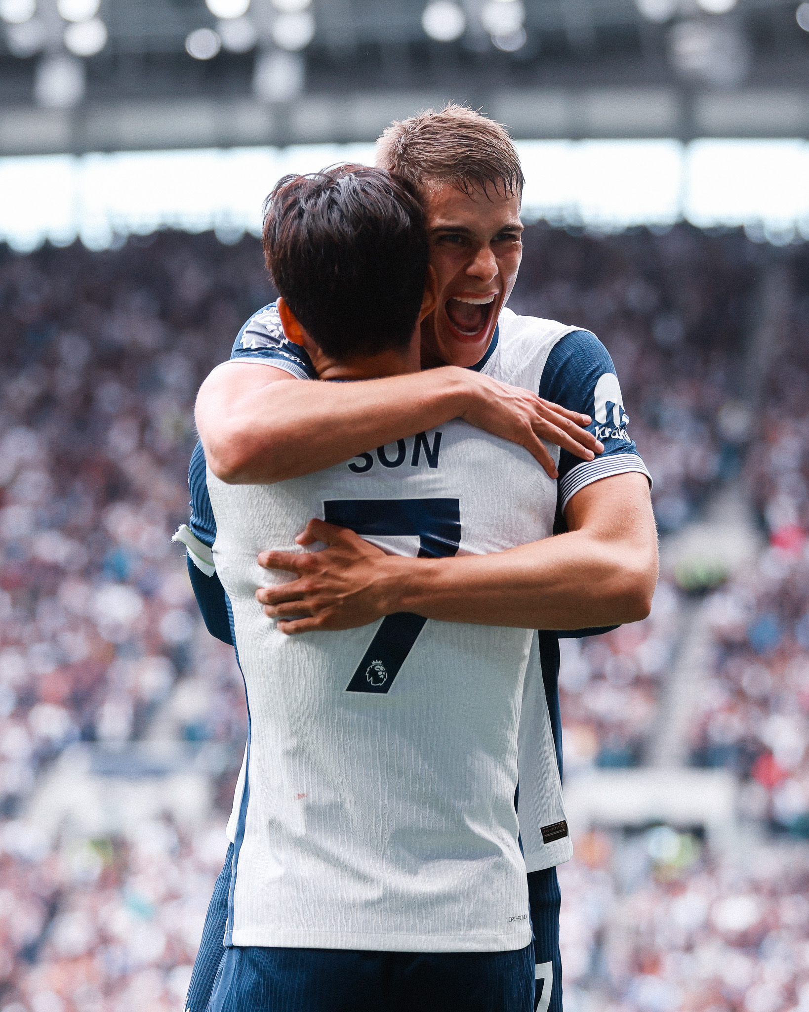 Micky van de Ven hugs Son Heung-min after assisting his goal.