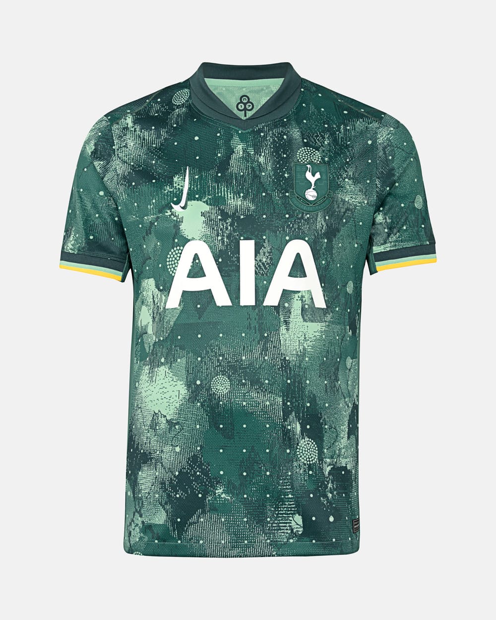 The Tottenham third kit for 2024/25, green with an abstract pattern, tri-tone sleeve trim, vertical Nike swoosh, and retro monochrome badge.