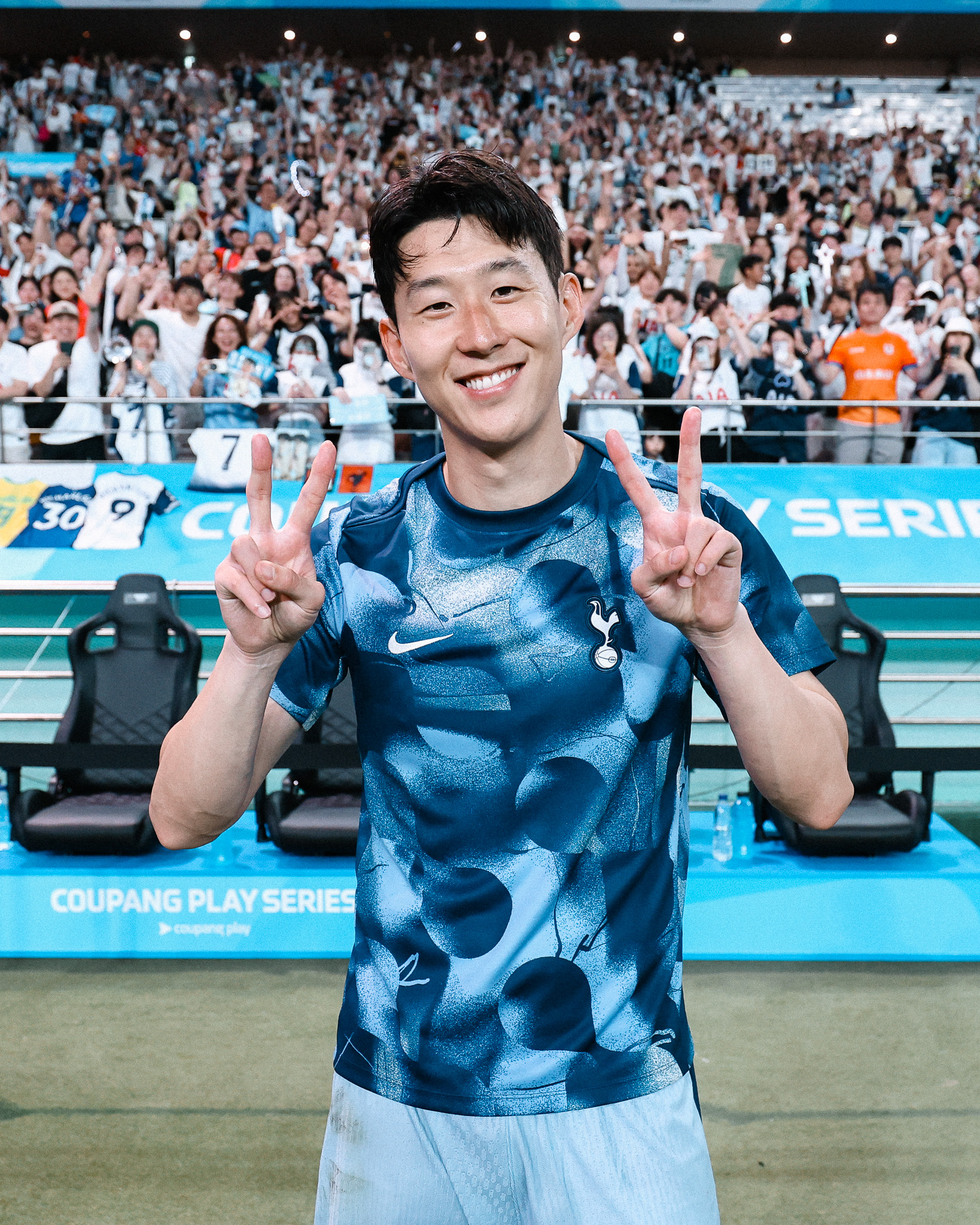 Son Heung-min throws up two peace signs.