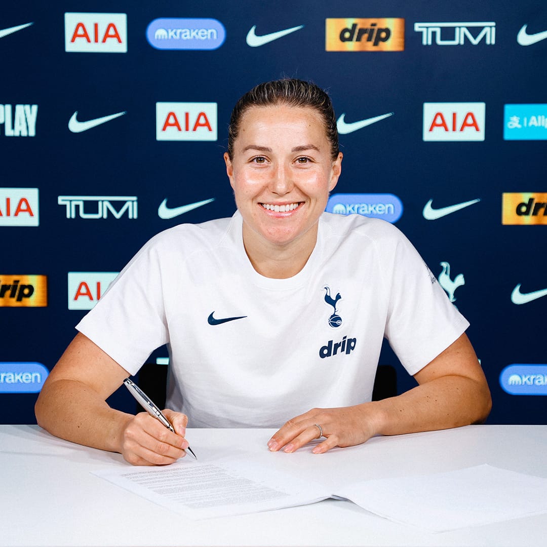 Amy James-Turner signs her new contract.