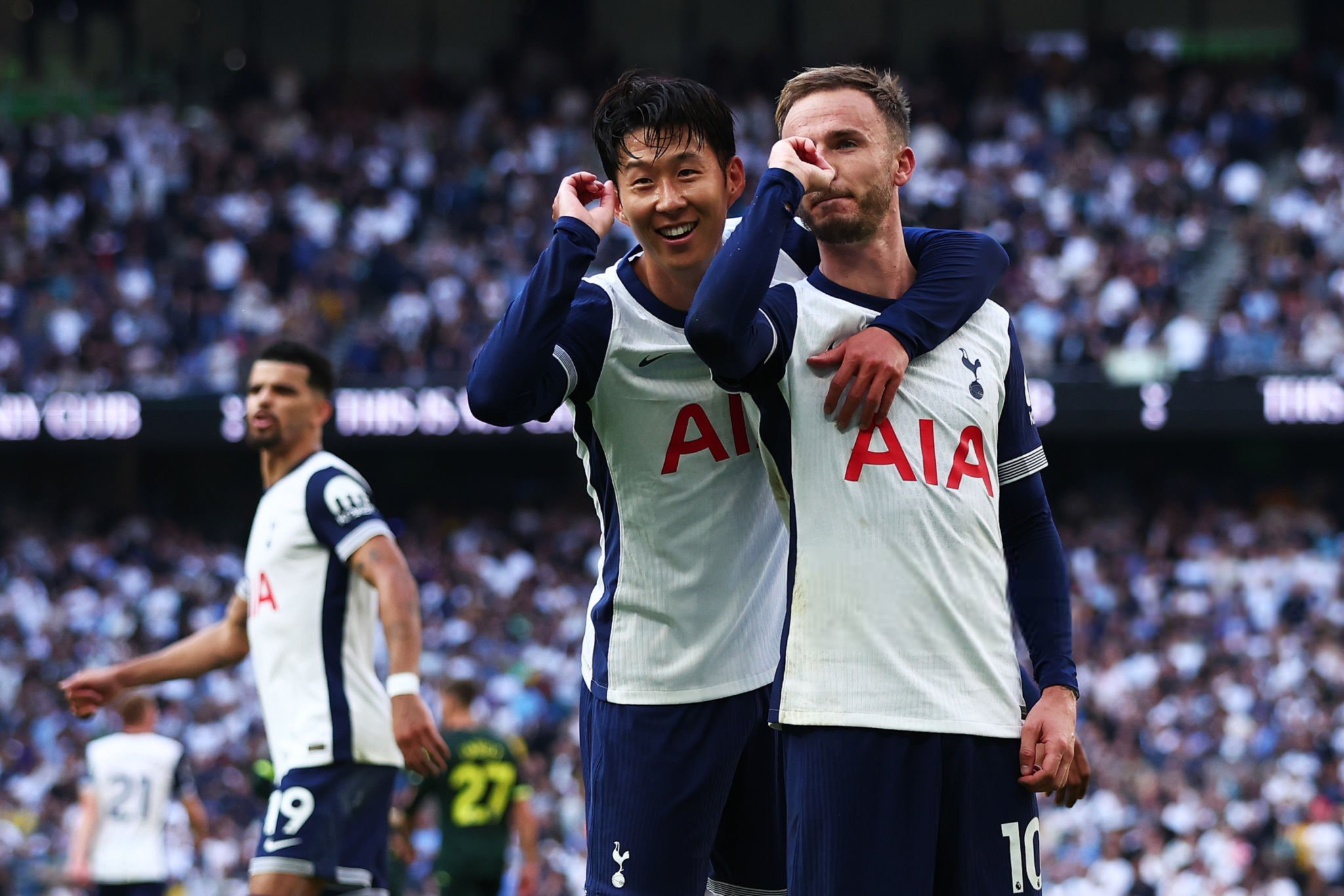 Son Heung-min joins James Maddison in his darts goal celebration.