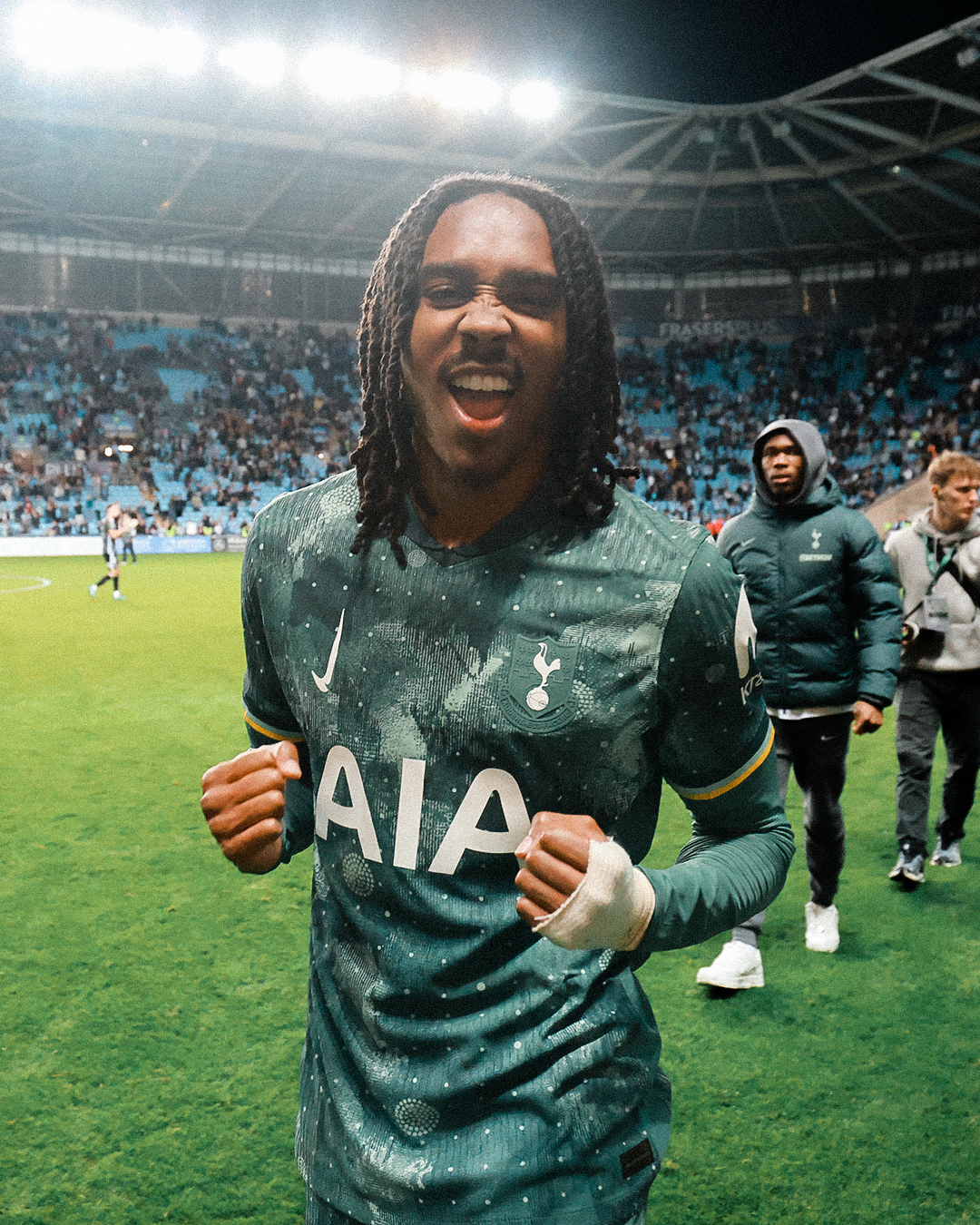 Djed Spence brandishes his fists in celebration after scoring his first Spurs goal.