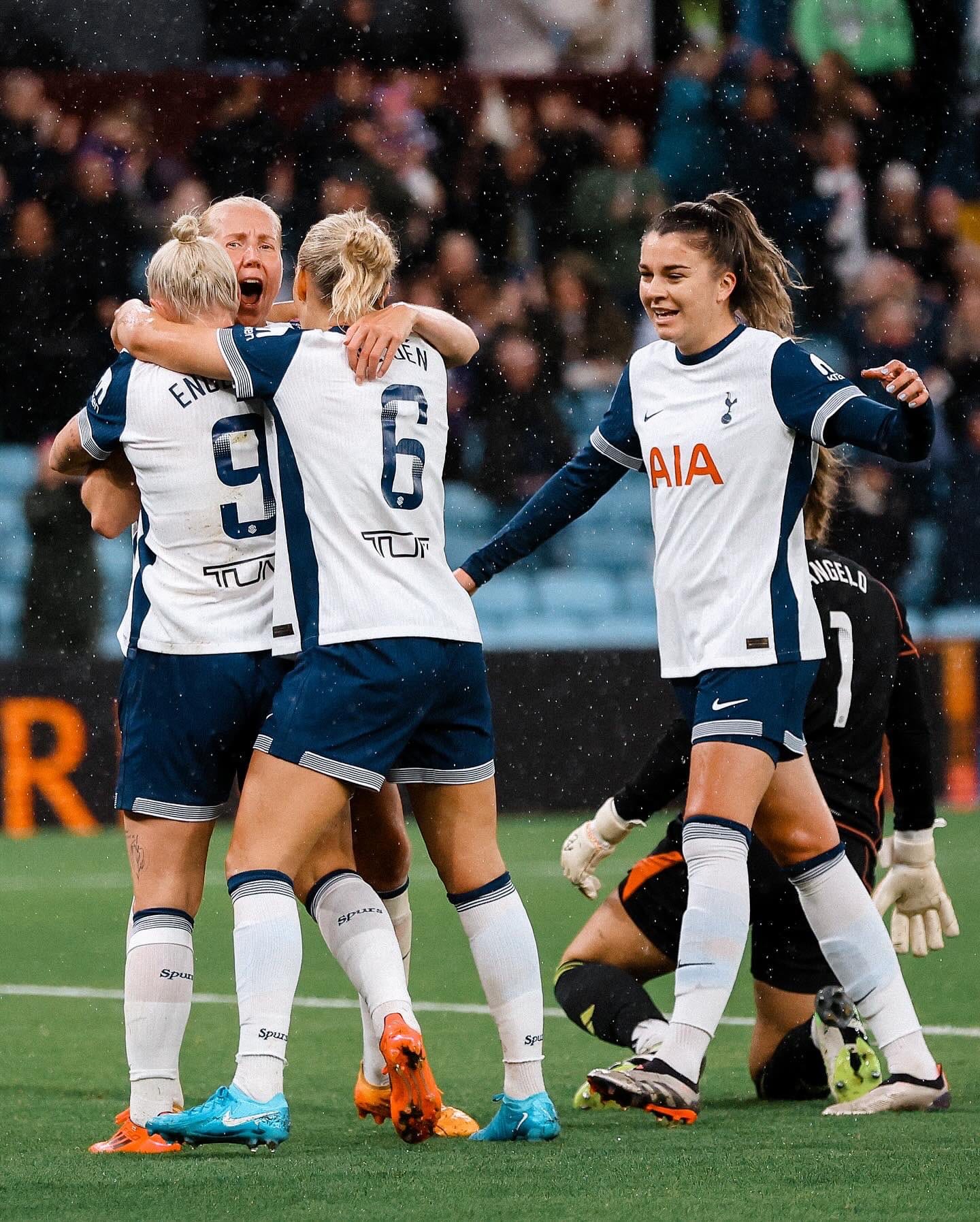 Eveliina Summanen roars in delight as Anna Csiki approaches her, Beth England, and Amanda Nildén to join the group hug.