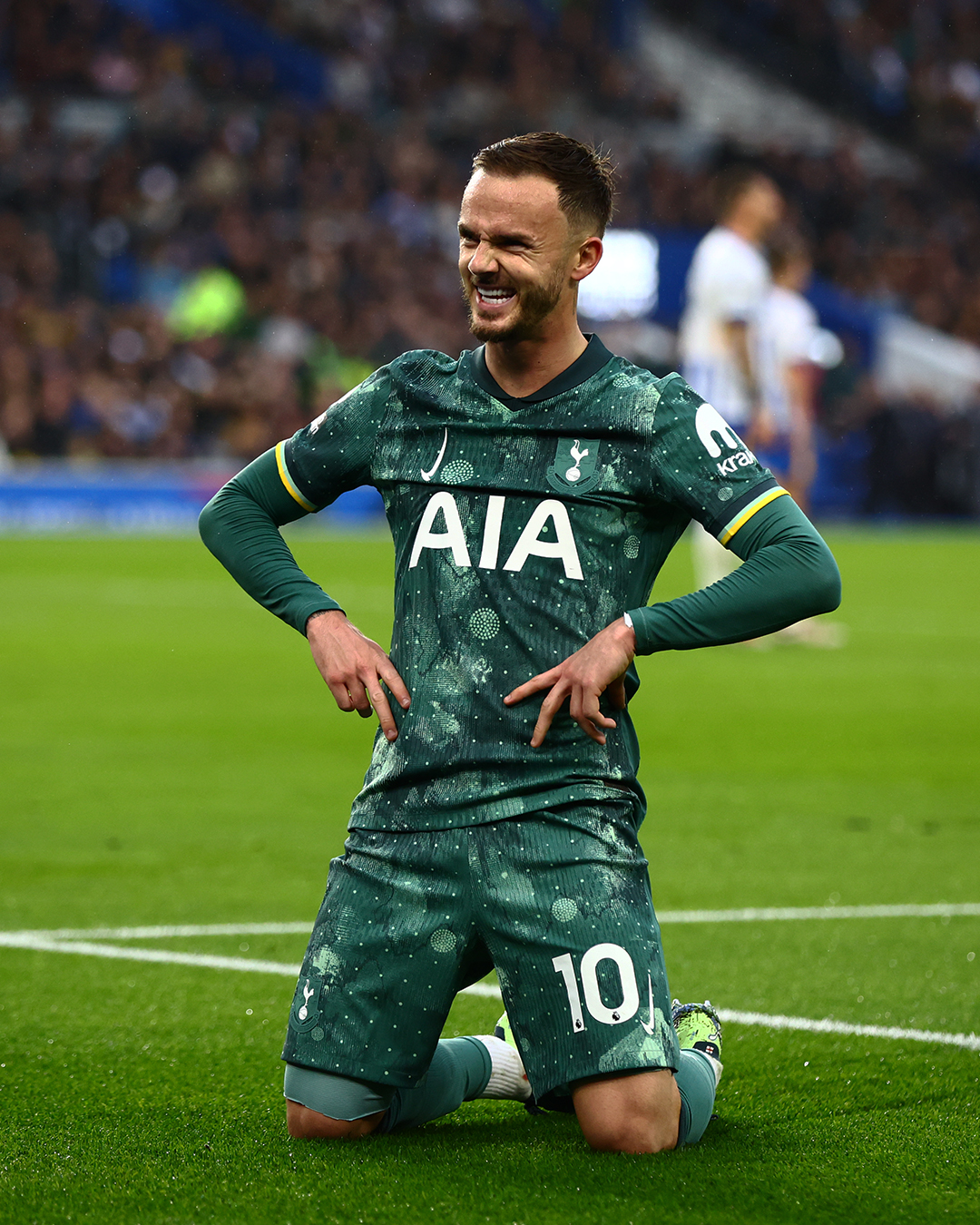 James Maddison celebrates his goal by dropping to his knees and grinning.