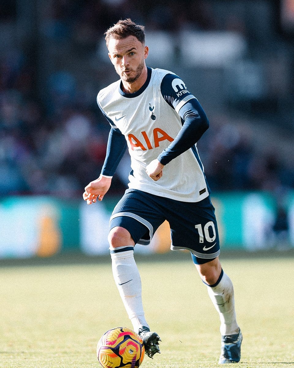 James Maddison dribbles the ball.