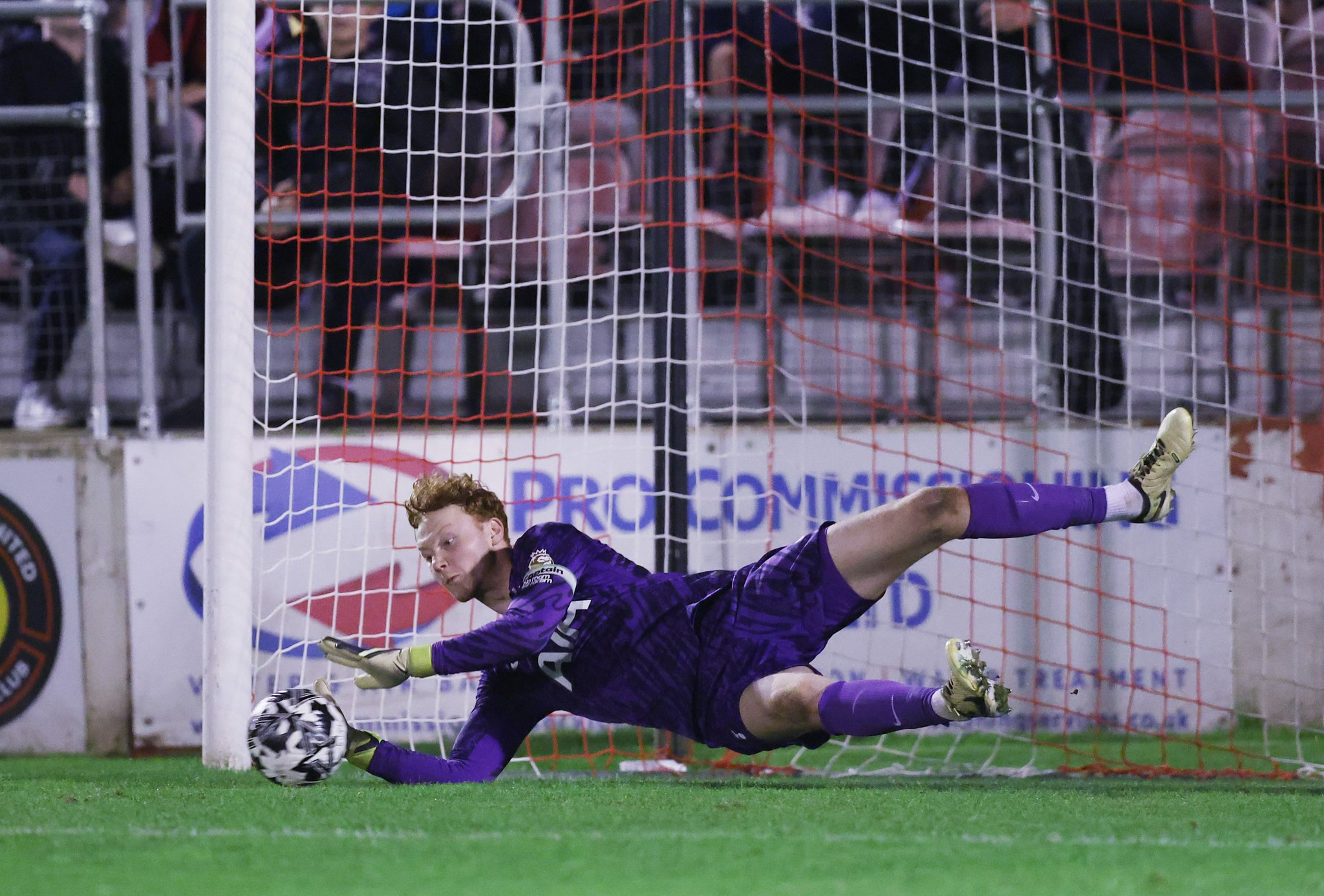 Aaron Maguire makes a save in the penalty shootout.