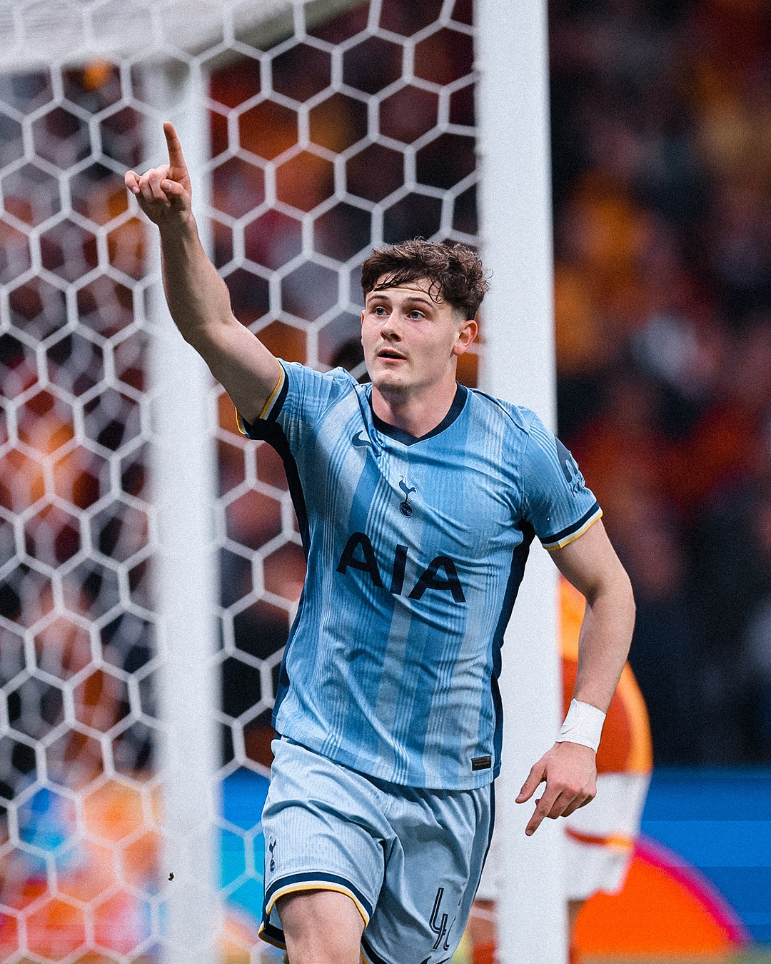 Will Lankshear points with his hand in the air to celebrate his first senior Spurs goal.