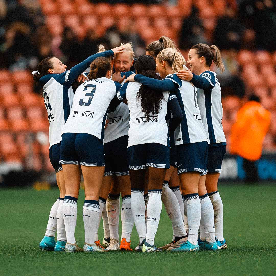 Eveliina Summanen is surrounded by her teammates after scoring from 40 yards.