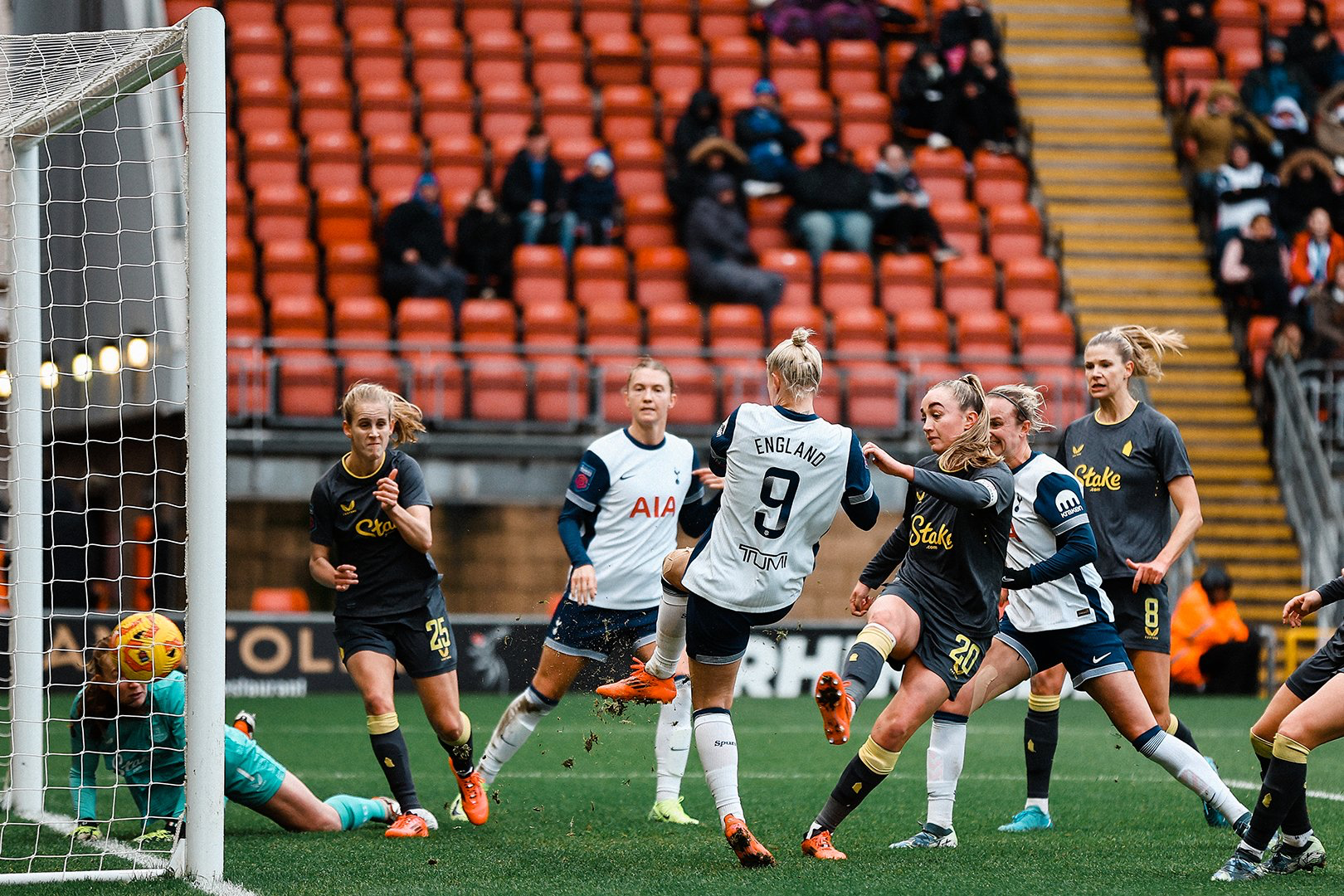 Beth England scores from close range in a congested six-yard box.