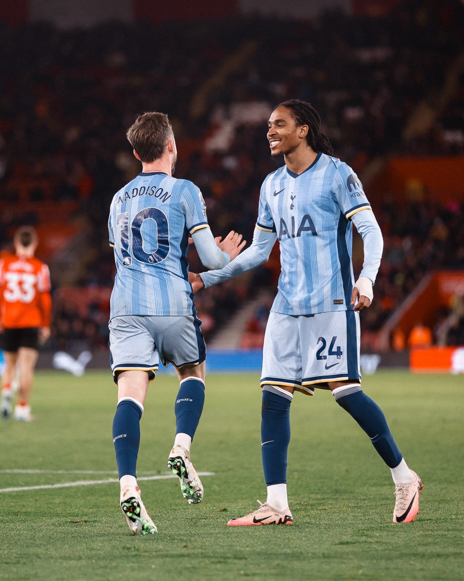 Djed Spence approaches James Maddison after providing an assist for Maddison's early goal.