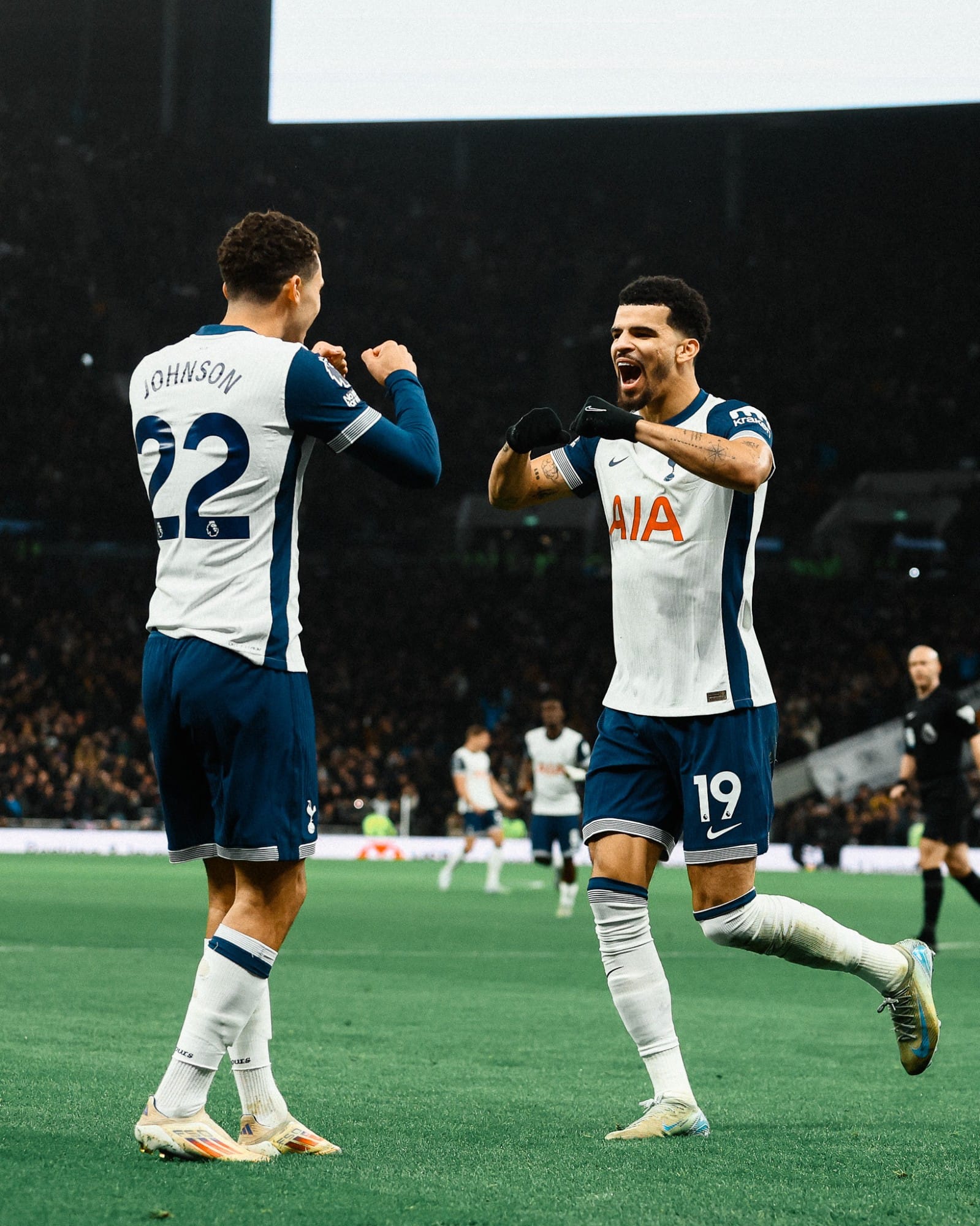 Dominic Solanke prepares for a double fist bump with Brennan Johnson after the former scored.