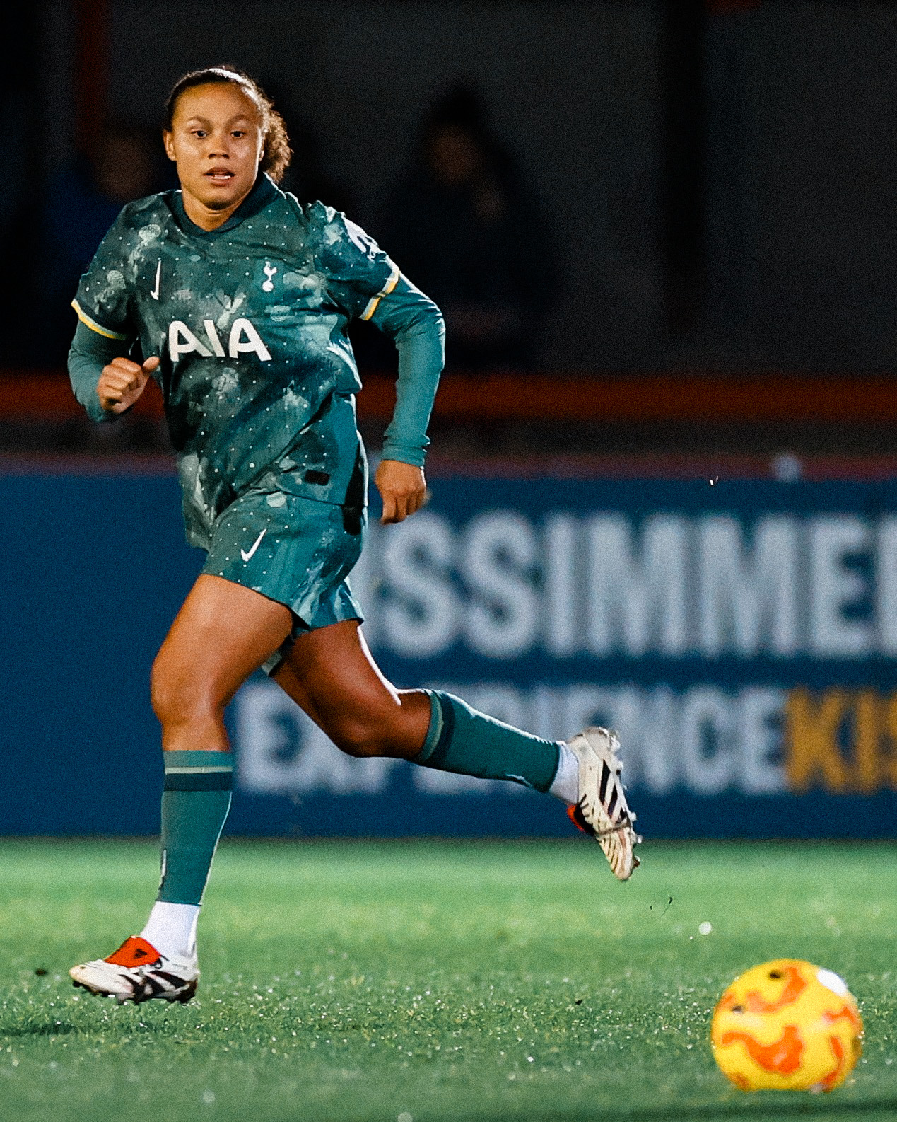 Drew Spence eyes the ball while she runs.