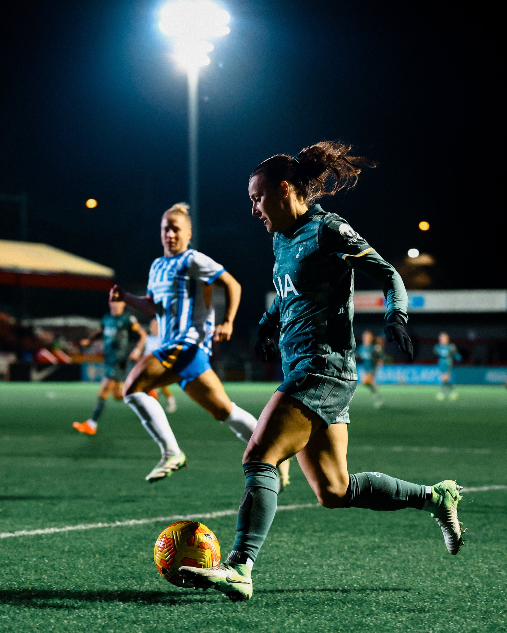 Hayley Raso dribbles the ball just outside the box.