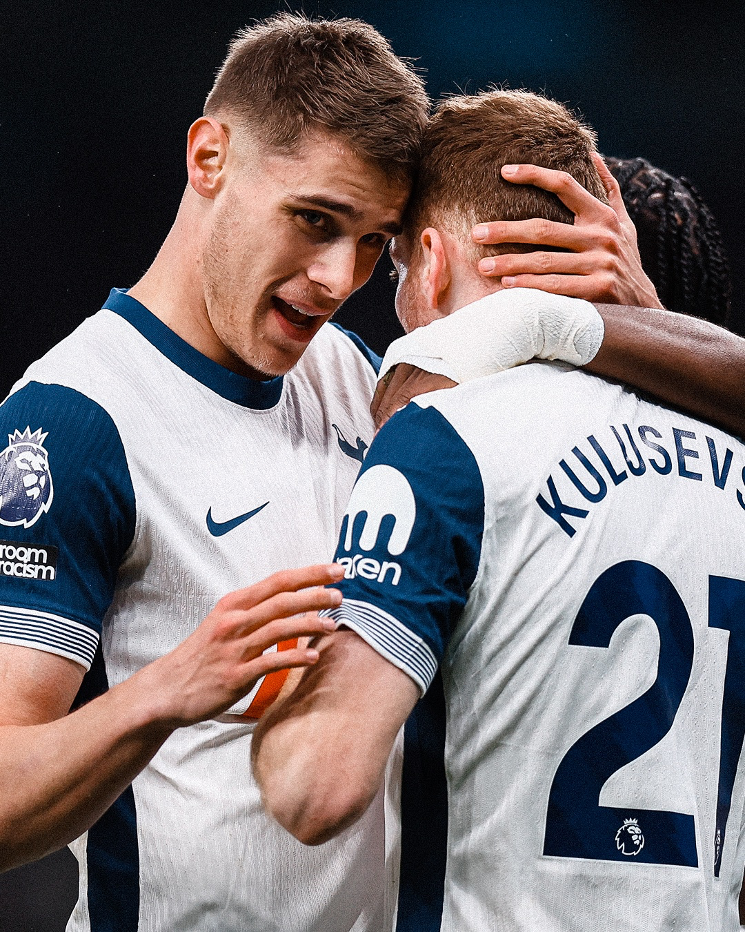 Micky van de Ven hugs Dejan Kulusevski after the latter scored.