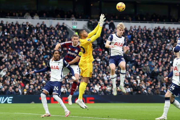 Brandon Austin jumps up to capture a ball with Spurs and Newcastle players surrounding him.