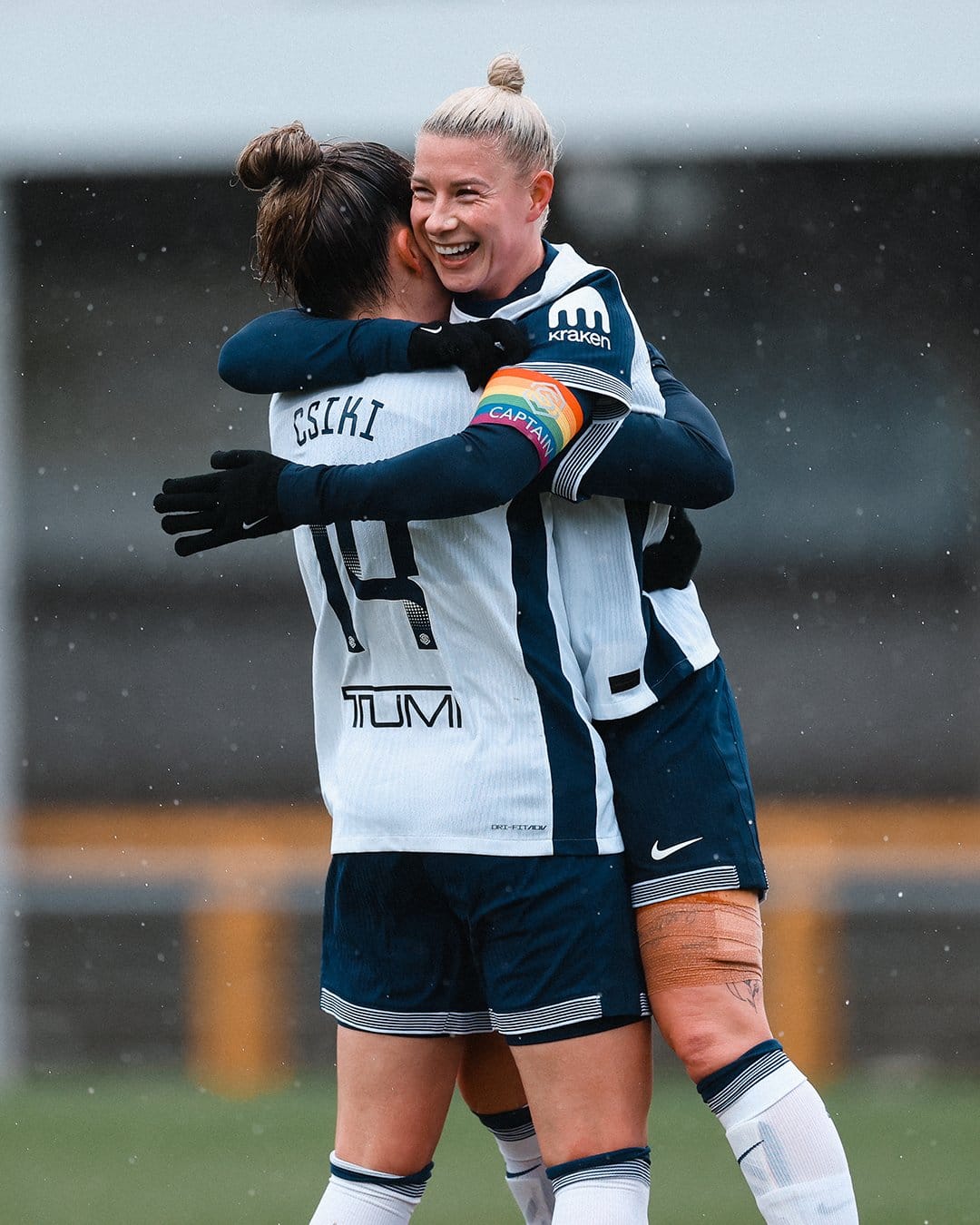 Anna Csiki is hugged by a leaping Beth England after the former assisted the latter's first goal of the game.