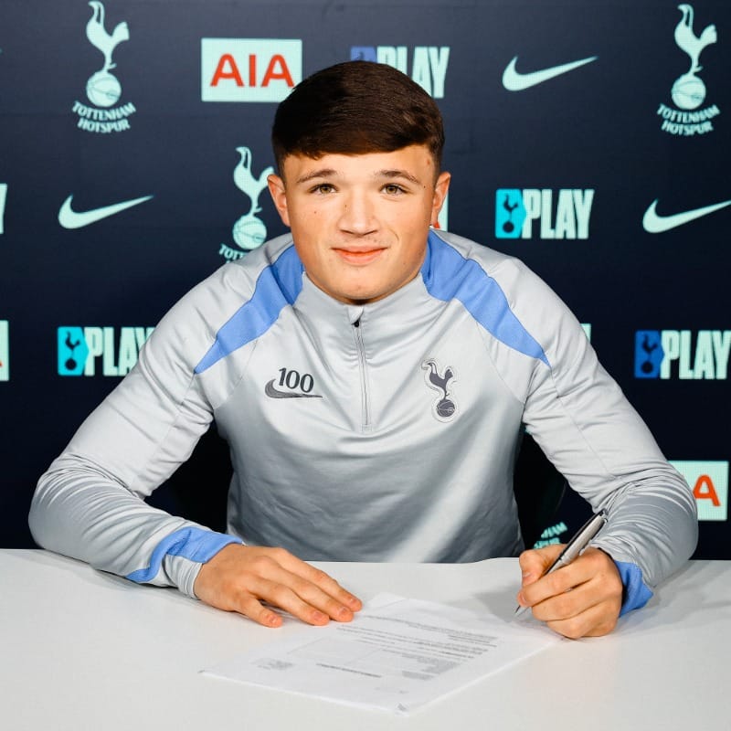 George Feeney signs his first professional contract with Spurs.