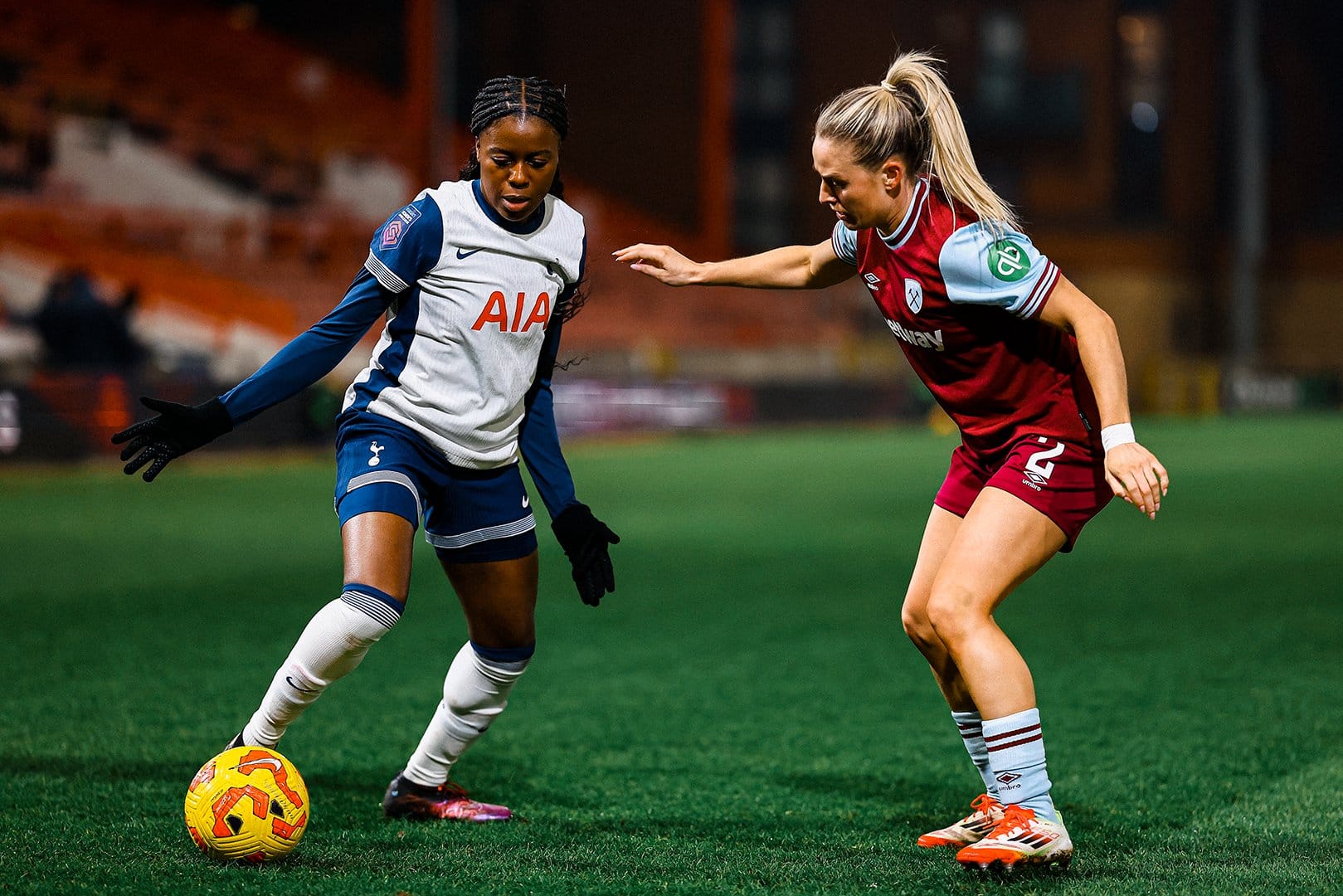 Jess Naz enters a duel with West Ham's Kirsty Smith.