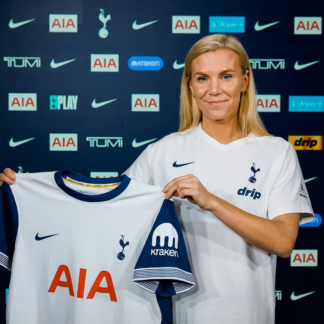 Josefine Rybrink holds up her new Spurs home kit.