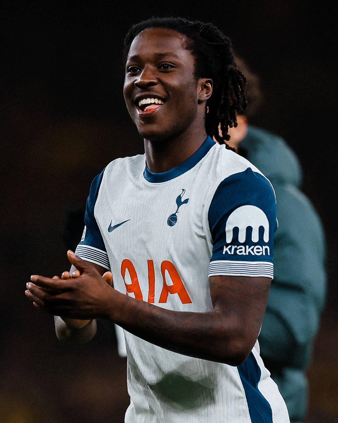 Damola Ajayi smiles and claps after the final whistle. 