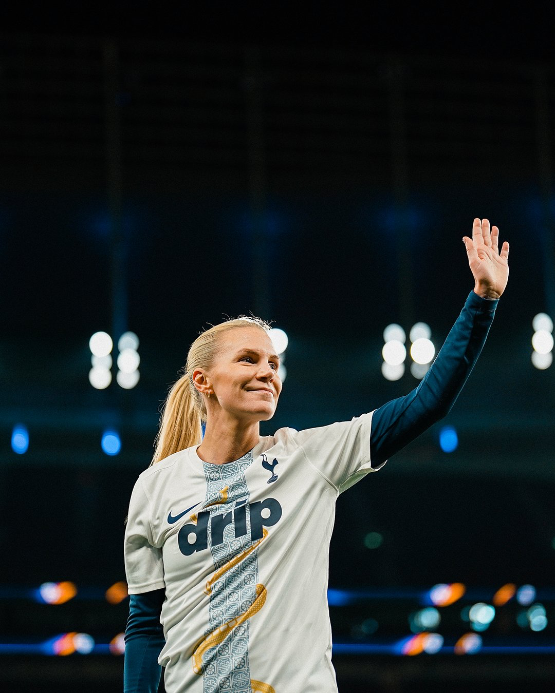 Josefine Rybrink smiles and waves at fans in the Lunar New Year warmup kit.