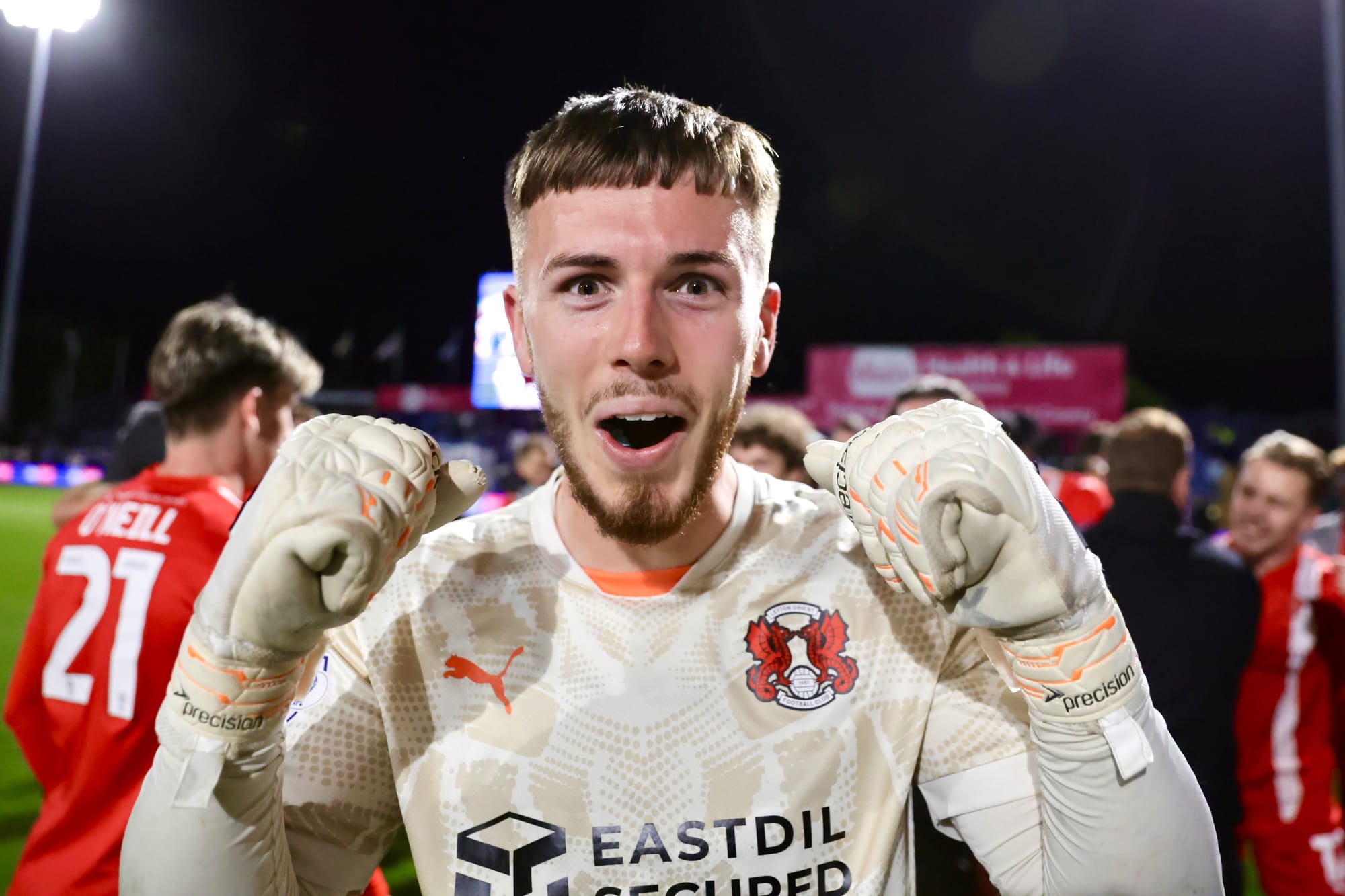 Josh Keeley holds up his fists to celebrate Leyton Orietn reaching the League One playoff final.