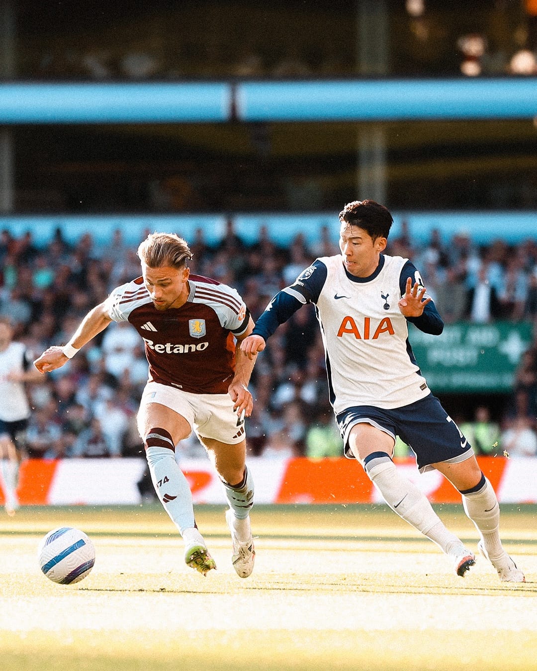 Son Heung-min challenges Matty Cash for the ball.