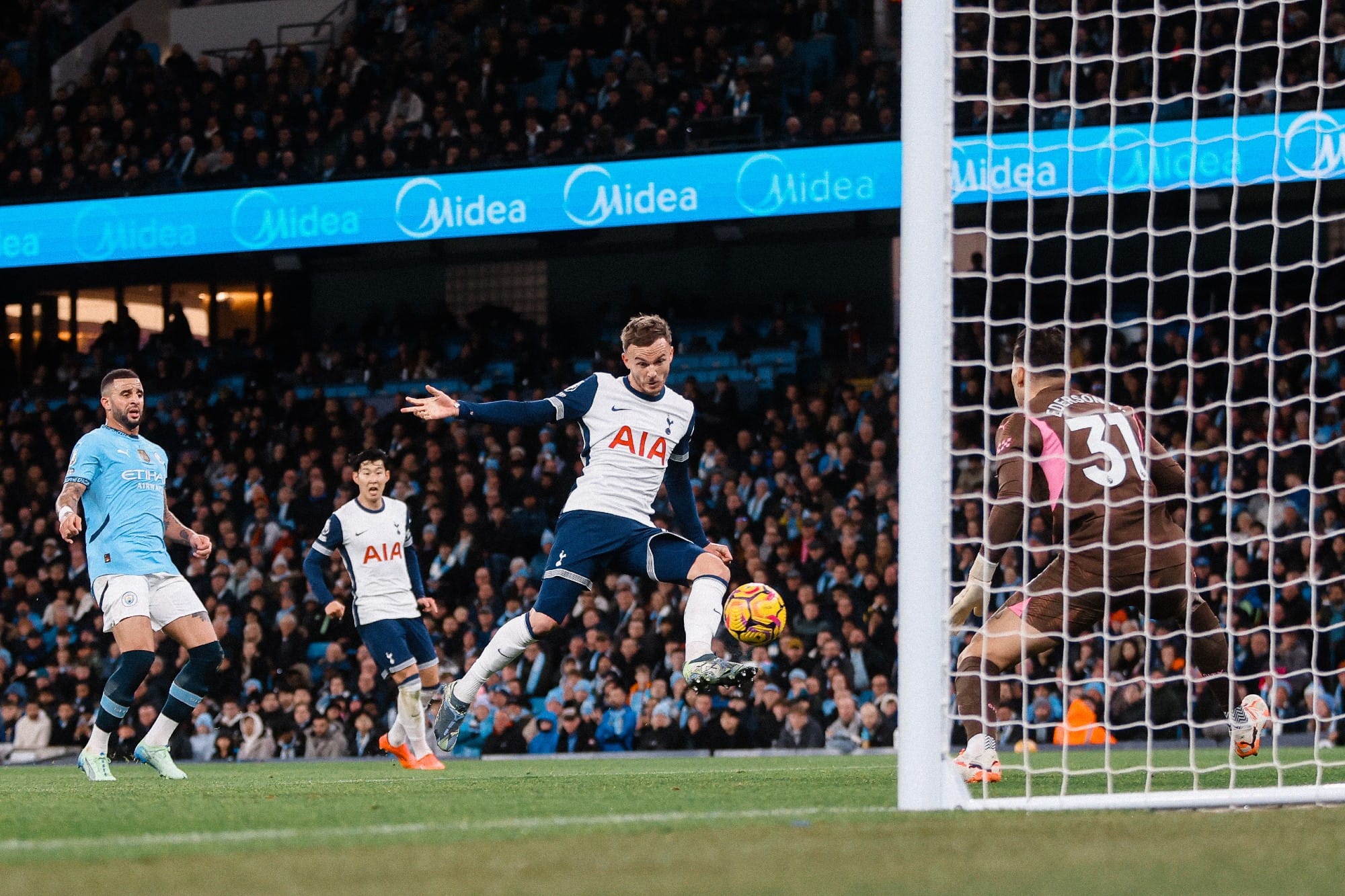 James Maddison volleys a shot towards goal.