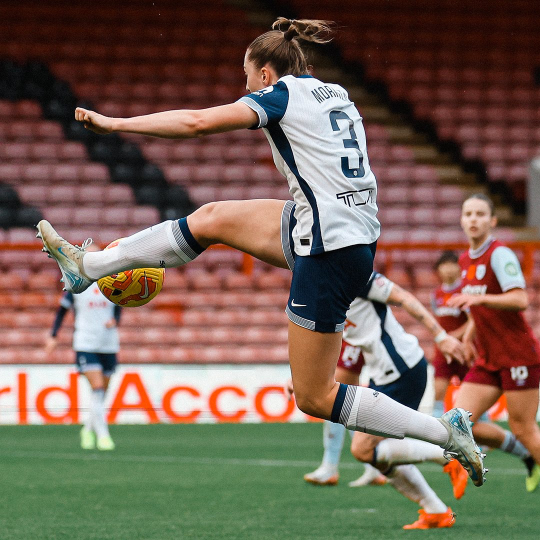 Ella Morris leaps to meet a ball in the air.