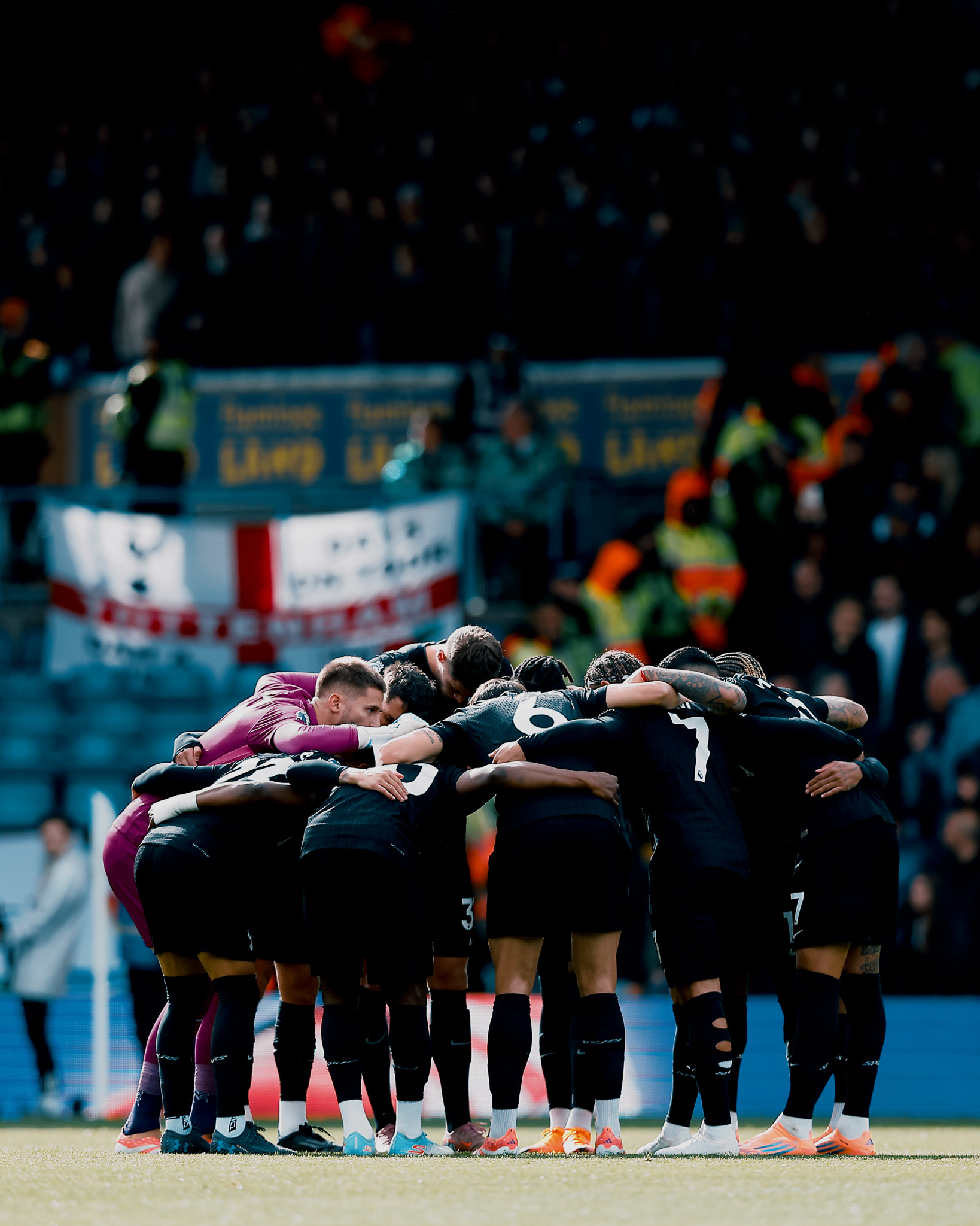 The starting XI huddles before the game.